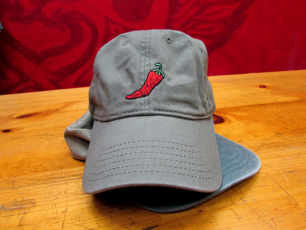 dad hat featuring a new mexico red chile embroidery