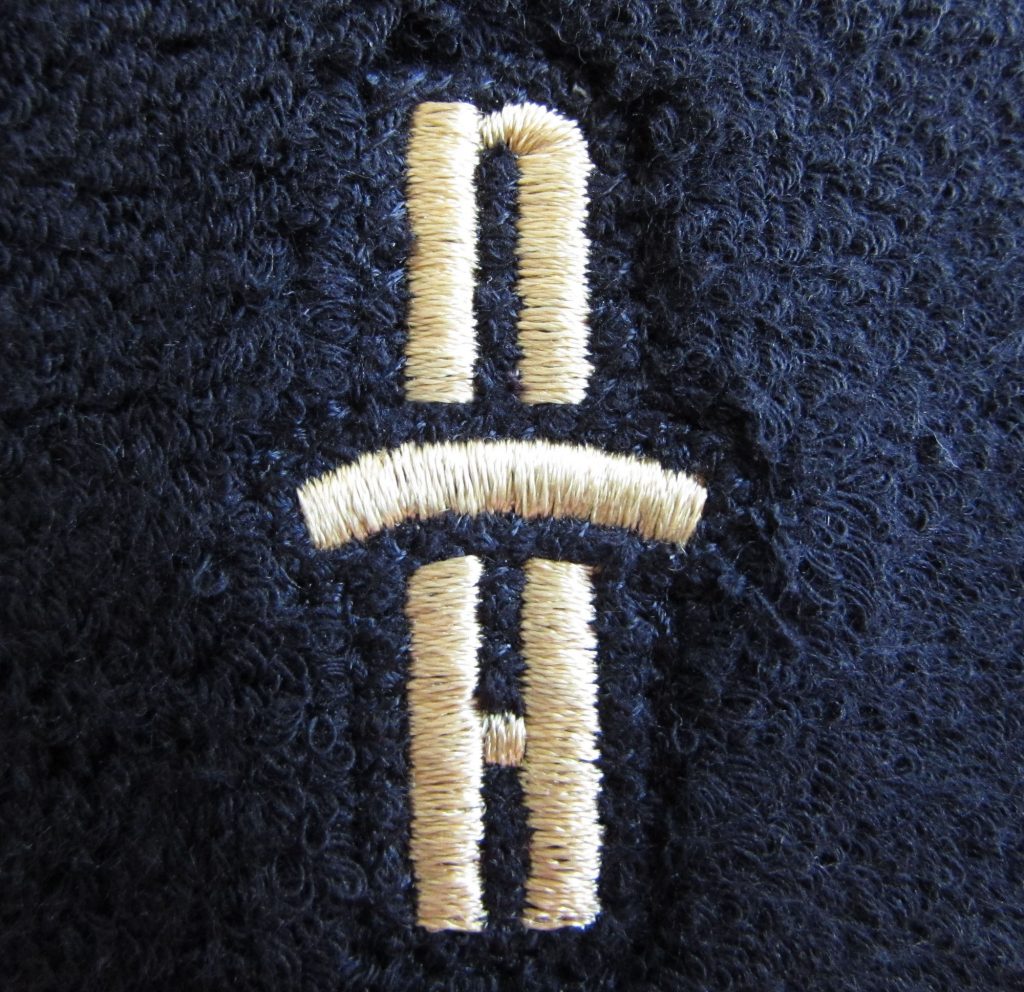 nh logo on terrycloth wristband